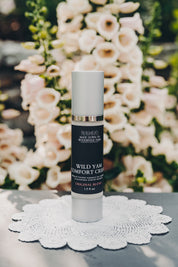 Wild Yam Cream in eco-friendly packaging on table sold by Barbara O'Neill