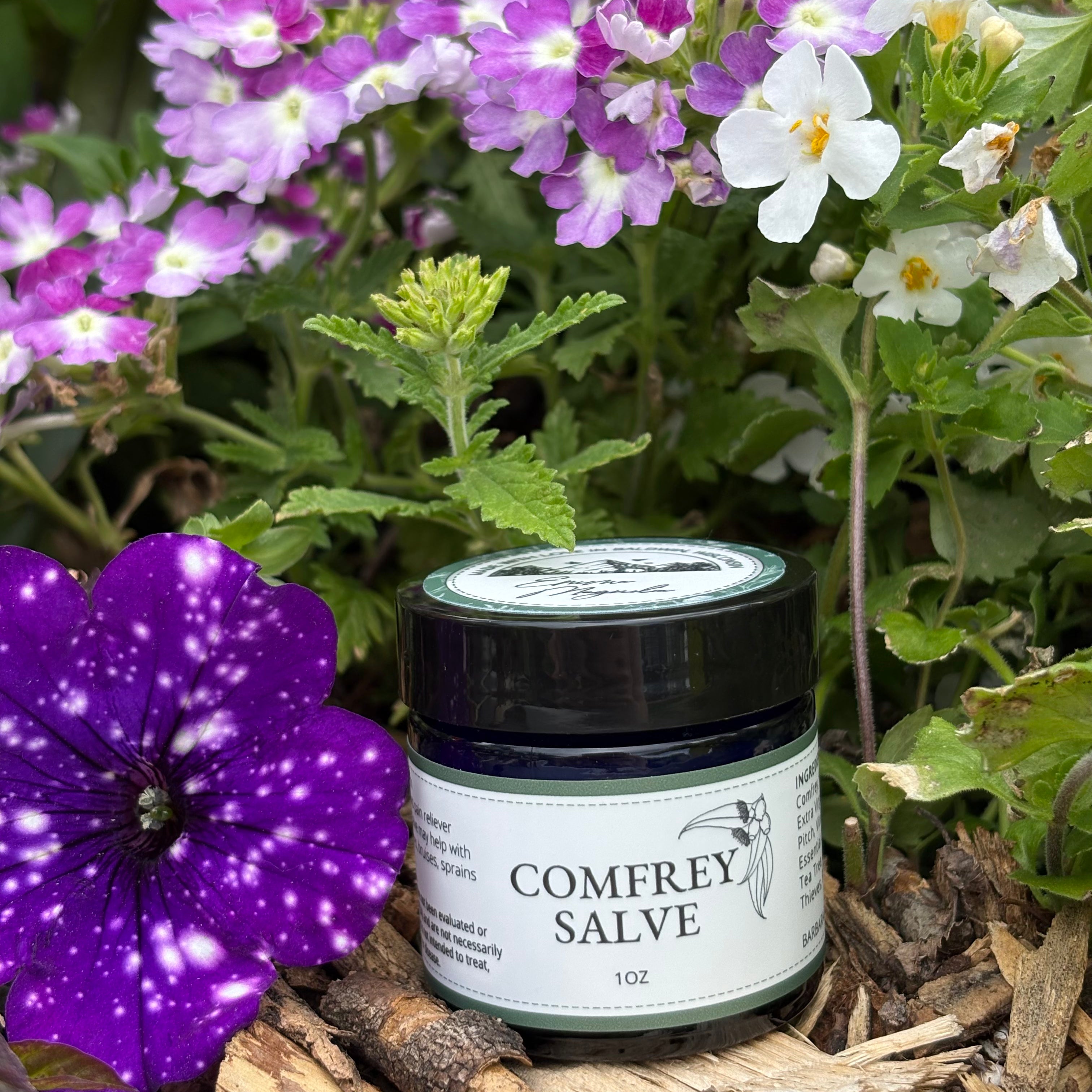 Jar of Comfrey Salve 1oz with flowered background