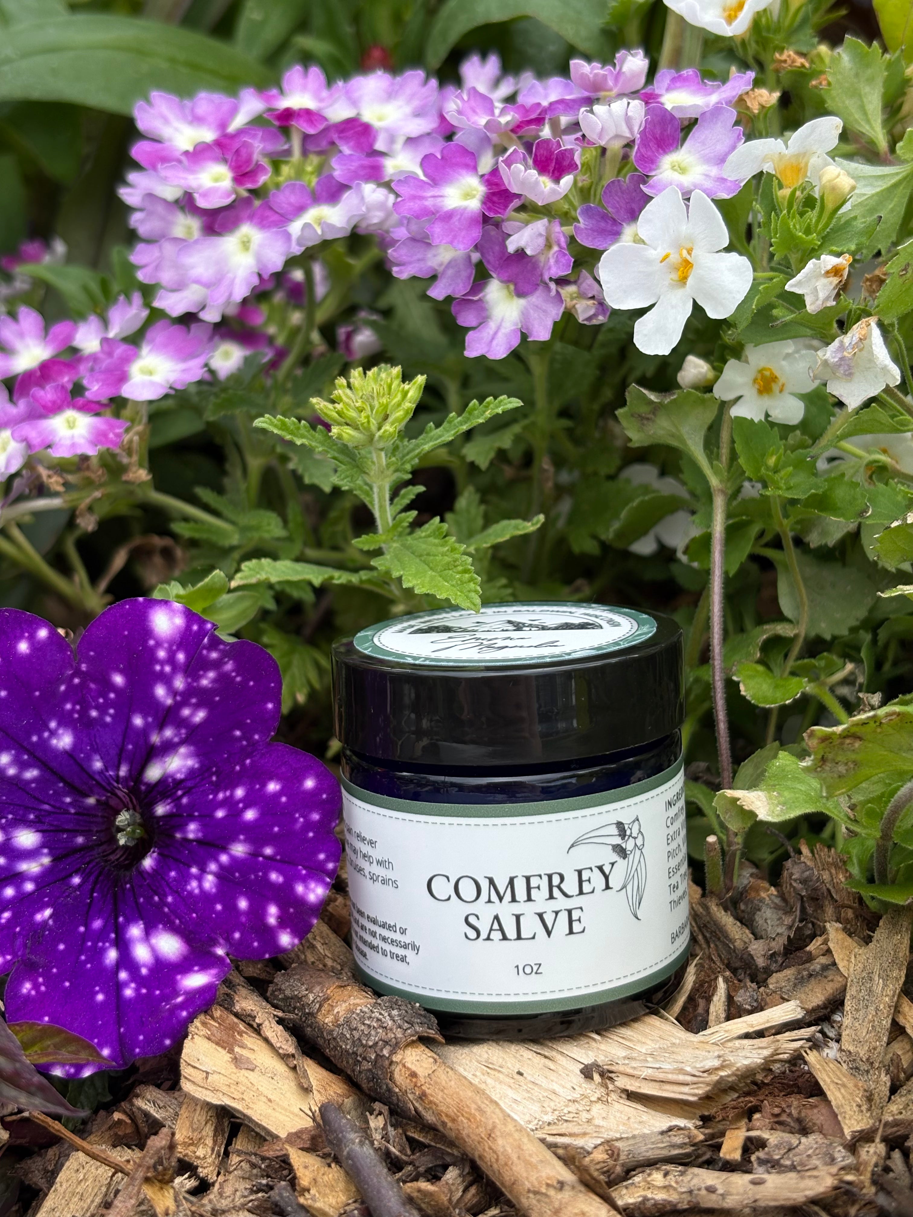 Jar of Comfrey Salve 1oz with flowered background